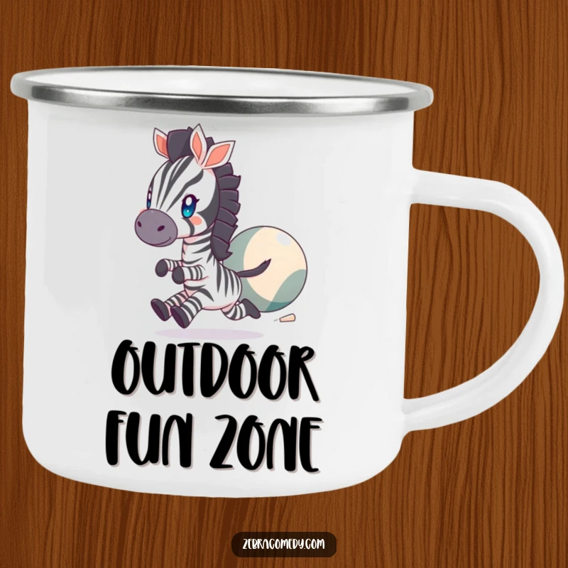 Funny Camping Mug featuring a zebra character with twinkling eyes, joyfully chasing a large bouncing ball, perfect for outdoor fun.