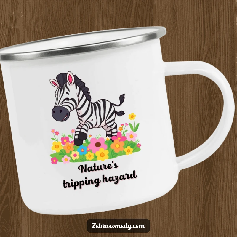 Funny camping mug depicting a zebra comically slipping on vibrant flowers, perfect for outdoor enthusiasts.