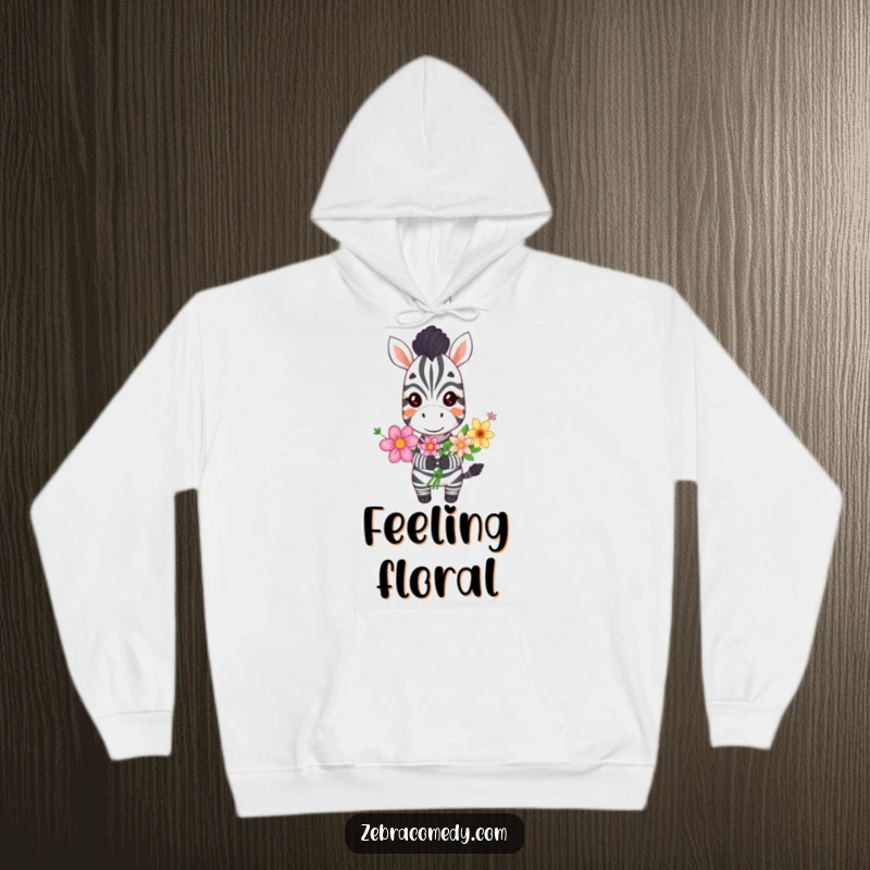 Funny grinning zebra hoodie depicting a happy zebra holding a vibrant bouquet of flowers, perfect for cozy, cheerful moments.