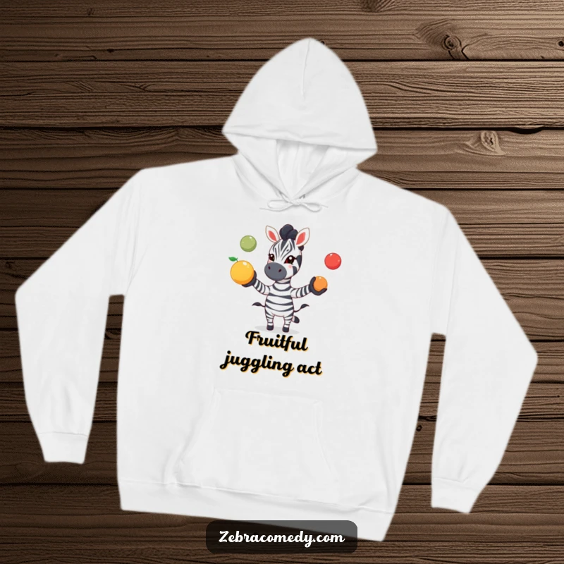 Funny zebra hoodie showing a zebra playfully juggling colorful fruit with excitement, offering cozy warmth and a touch of vibrant fun.