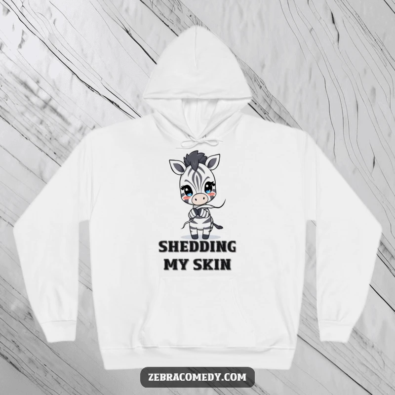 Funny Hoodie featuring a zebra character playfully tugging on an unraveling stripe, offering warmth and a humorous visual gag.