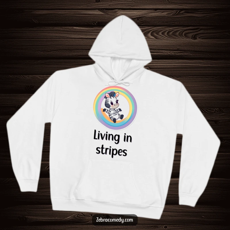 Funny Zebra Hoodie: A cartoon zebra sliding down a rainbow with excitement, cozy and fun, gift idea.