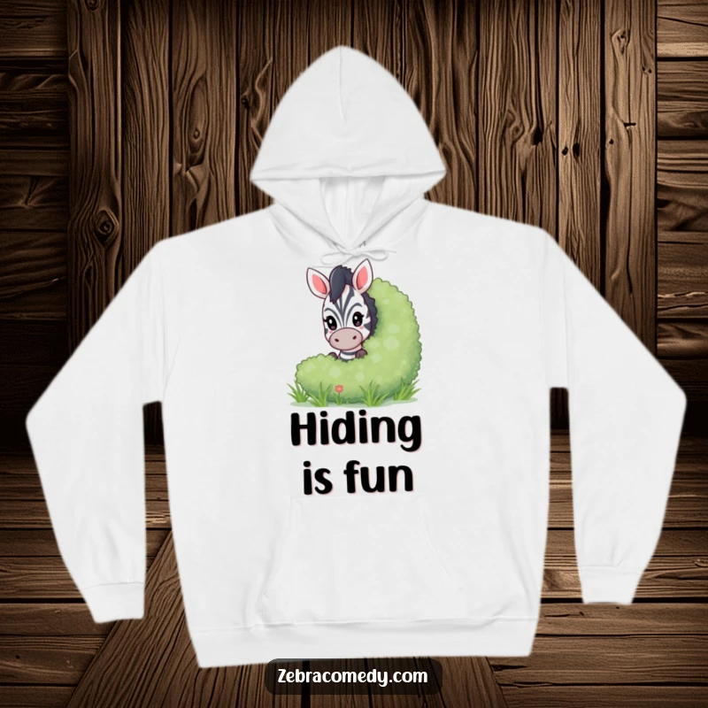 Funny peeking zebra hoodie depicting a playful zebra peeking from behind a lush bush, ideal for cozy, mysterious moments.