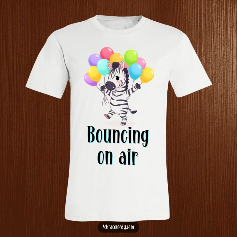 Funny T-Shirt showing a joyful zebra character enthusiastically dancing with a large bunch of bright, colorful balloons, radiating pure happiness.