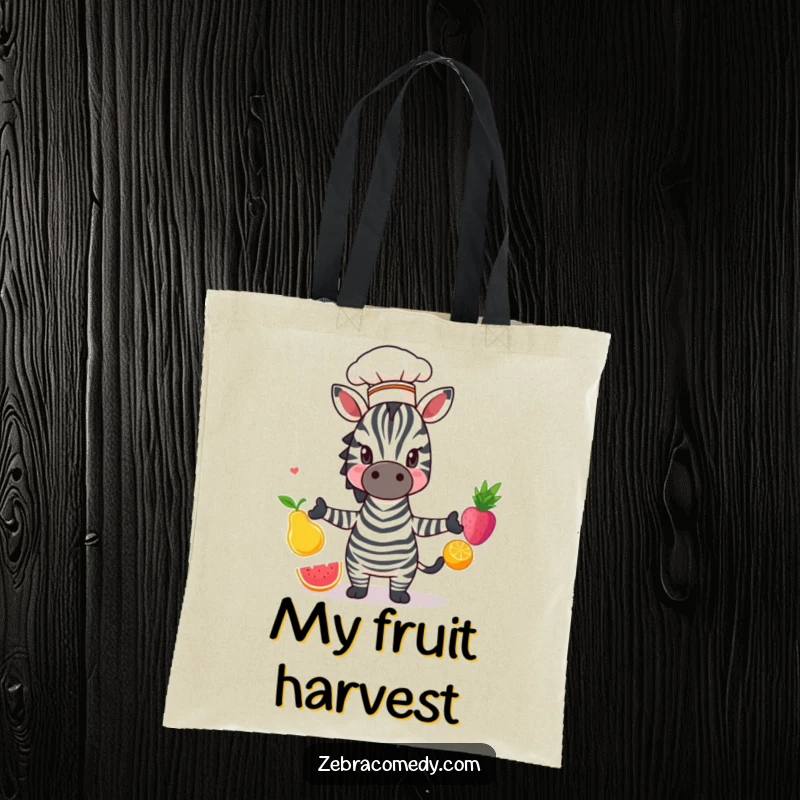 Funny Zebra Tote Bag: A zebra wearing a chef hat, juggling colorful fruit, perfect for carrying essentials with culinary flair.